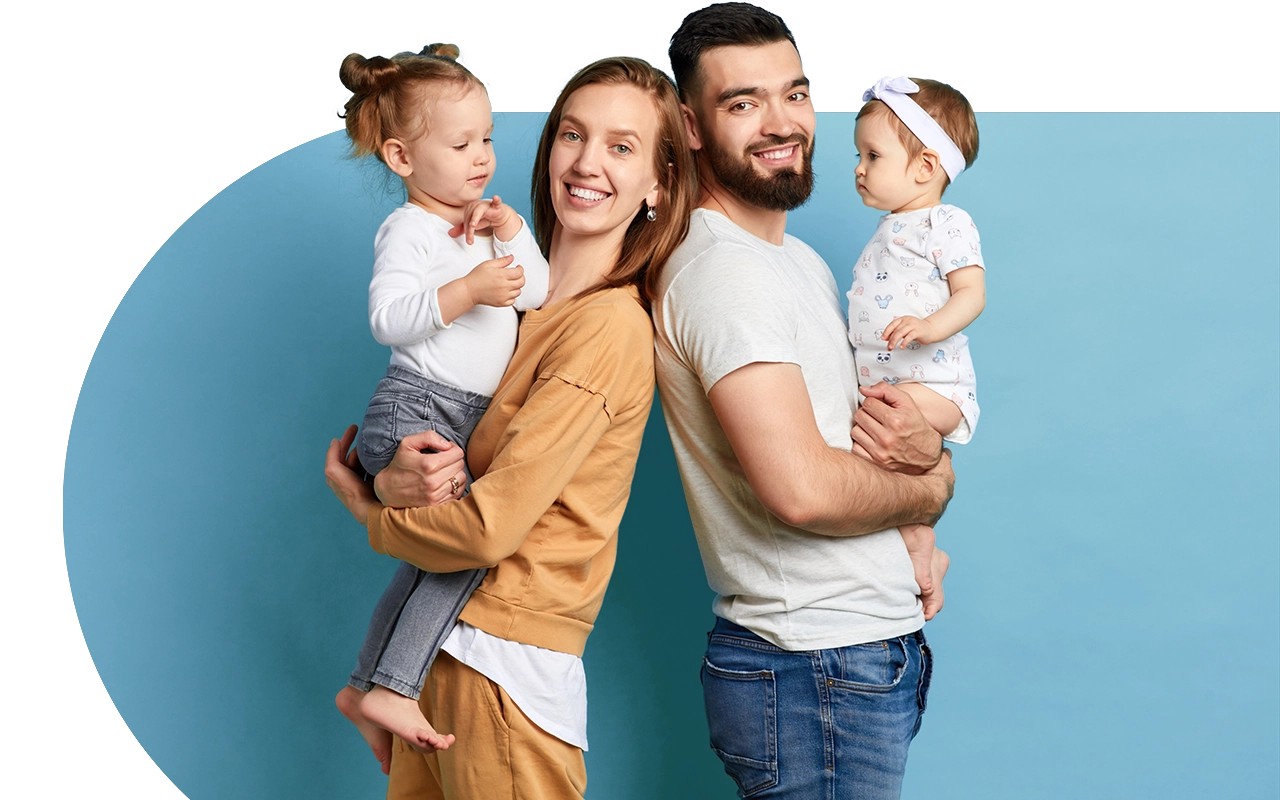 happy young family with two children smiling